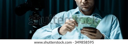 Man counting his money for dirty work
