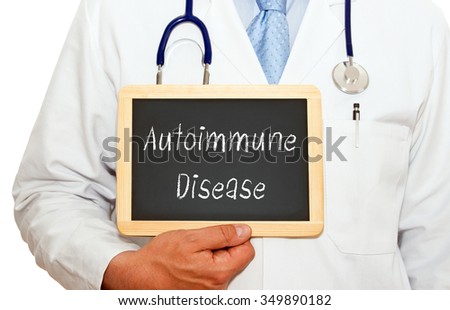Autoimmune Disease - Doctor holding chalkboard with text on white background Royalty-Free Stock Photo #349890182