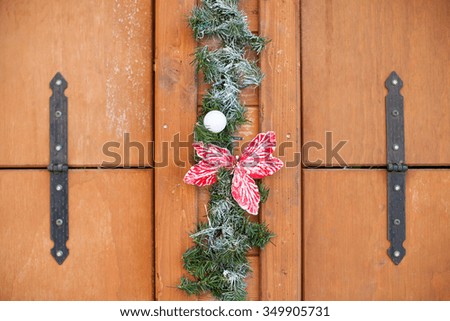 Christmas background with pine branch and white bauble on wooden board. Background  on wooden table with copy space