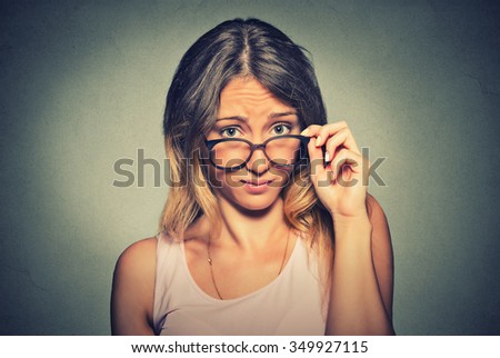 confused skeptical woman thinking looking at you with disapproval  Royalty-Free Stock Photo #349927115