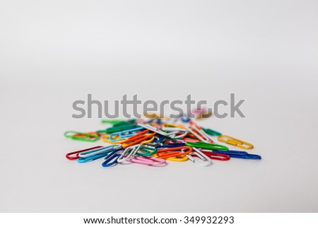 Colorful paperclips isolated on white background