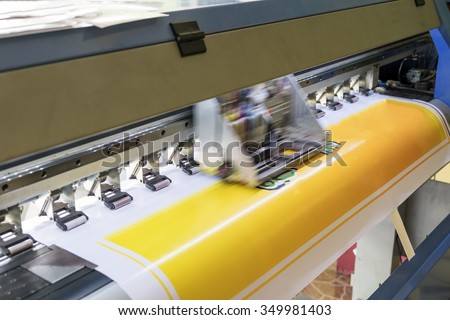 Large printer format inkjet working detail yellow color Royalty-Free Stock Photo #349981403