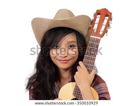 Close up portrait of smiling ethnic girl wearing cowboy hat and holding an acoustic guitar, isolated on white background