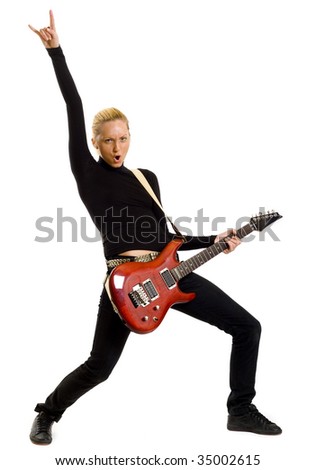 passionate blond woman guitarist playing the guitar and making a rock sign