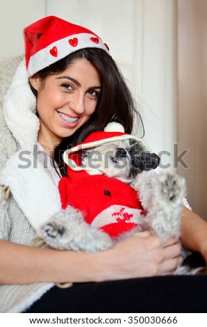beautiful woman with braces hugging her dog-Christmas time