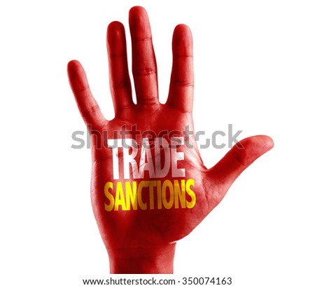 Trade Sanctions written on hand isolated on white background