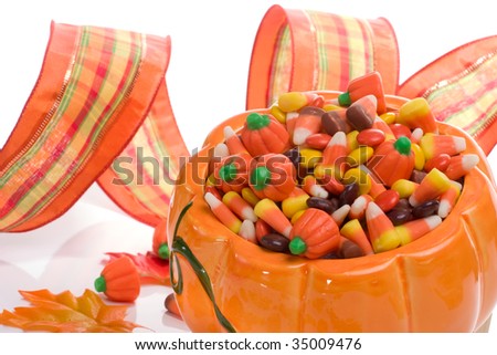 Orange pumpkin filled with delicious Halloween candies