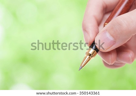 Pen, green background