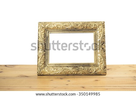 Vintage photo frame on wooden table over white background, Still life style
