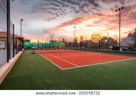 Tennis court at a private estate in the twilight and magic sky Royalty-Free Stock Photo #350198732