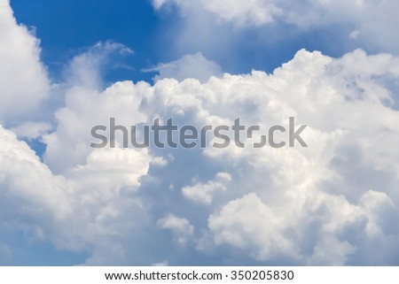 nice blue sky with cloudy. Image has grain or noise and soft focus when view at full resolution(Shallow DOF, slight motion blur).