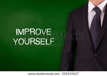IMPROVE YOURSELF on Blackboard with businessman