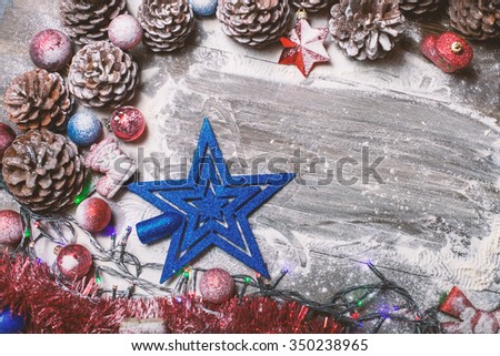 Beautiful decorated Christmas background. Stars and snow on a wooden background