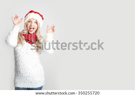 Christmas smiling Woman. Beauty Model Girl in Santa Hat