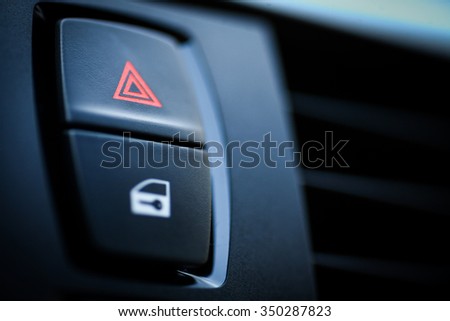 Detail of a warning button in a car.