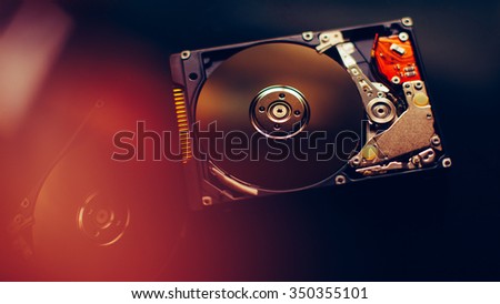 Disassembled hdd (hard disc) with mirror effects. Part of computer (pc, laptop)