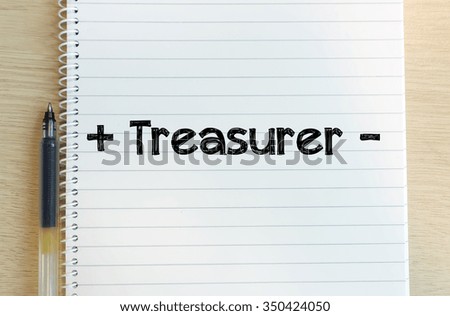 Word of " + treasurer - " in white note with black pen on the background of wood.