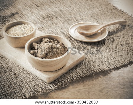 Ingredient grain,   Brown sugar and wheat germ in wooden bowl