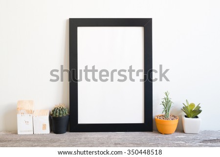 mockup of blank frame poster on wall
