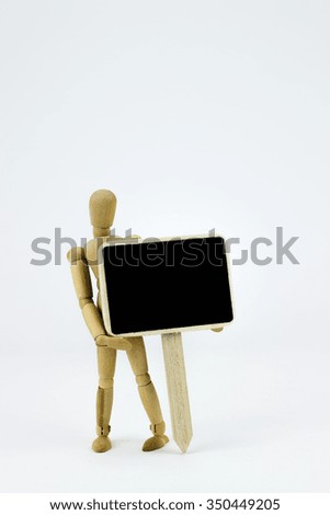 Wooden man with sign in front of white background
