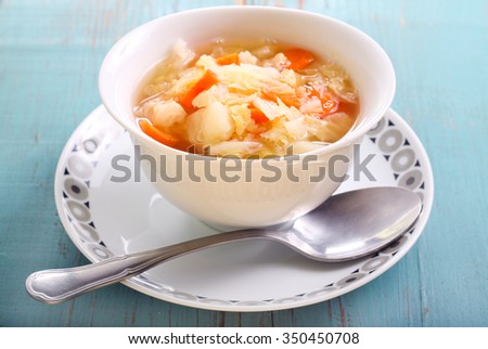 Vegetable soup in a bowl on wooden table