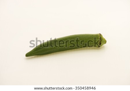 Closeup view on an okra, also commonly know as lady finger.  Isolated on white background.
