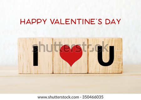 Happy valentine's day words on white background and I love you words on wooden cubes