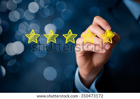 Review, increase rating or ranking, evaluation and classification concept. Businessman draw five yellow star to increase rating of his company. Bokeh in background. Royalty-Free Stock Photo #350473172
