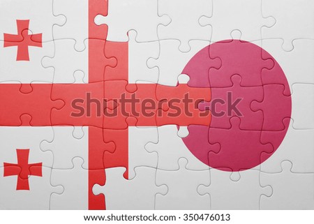 puzzle with the national flag of georgia and japan. concept