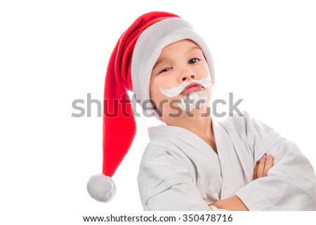 Boy in Santa hat isolated on white background