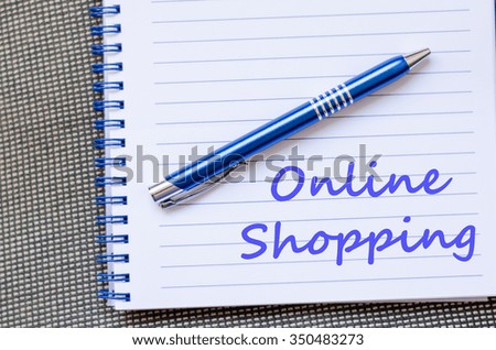Online shopping text concept write on notebook with pen