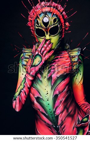 Woman wearing freak costume and mask