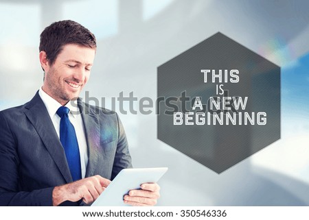 Motivational new years message against composite image of businessman using his tablet pc