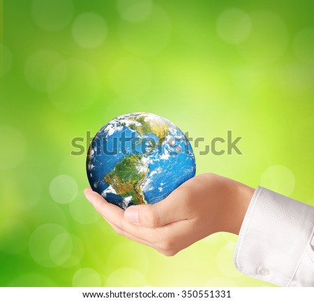 holding global in hands.Ecology concept. Elements of this image are furnished by NASA
