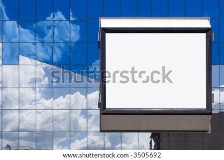 white bill board advertisement in glass brick wall in business building