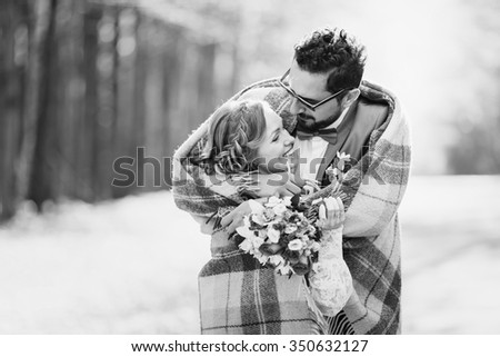 Wedding couple holding hands, hugging at autumn street