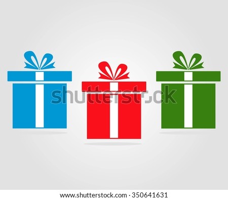 Three gifts on holiday on a gray background. Green, red, blue. 