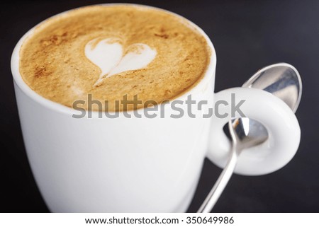 coffee cup of hot cappuccino with a heart