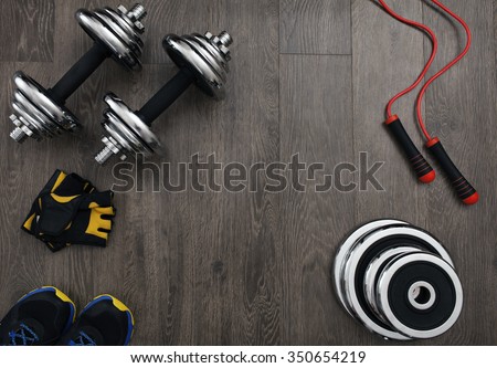 free space on the wooden floor surrounded fitness equipment Royalty-Free Stock Photo #350654219