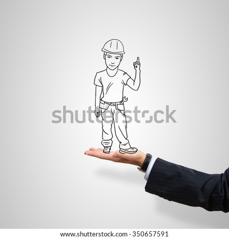 Drawn construction man in male palm on gray background