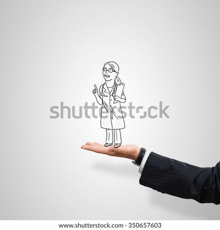 Drawn woman doctor in male palm on gray background
