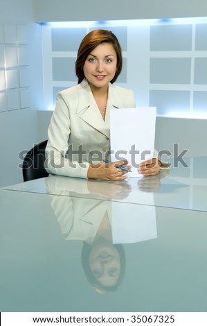 smiling business lady with papers at office