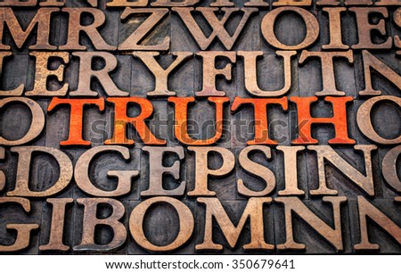 truth word abstract in wood type printing blocks stained by red ink