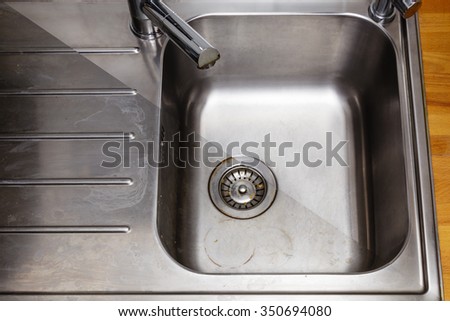 Dirty and cleaned to shine sink in the kitchen 