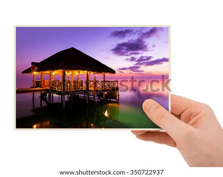 Hand and Maldives beach image (my photo) isolated on white background