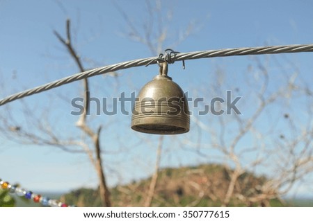 a bell hanging on a rope 