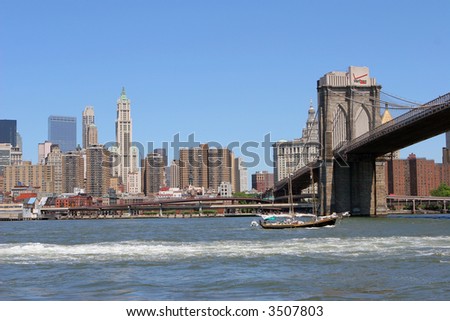 Brooklyn Bridge with Manhattan Skyline and a Sailboat