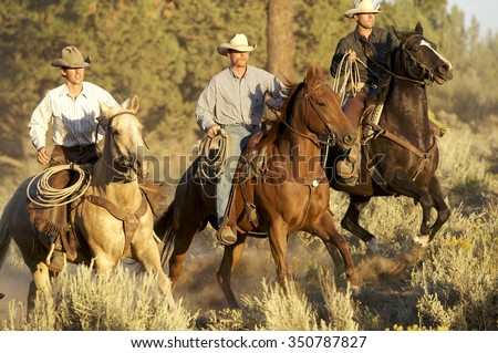 Three Cowboys galloping 