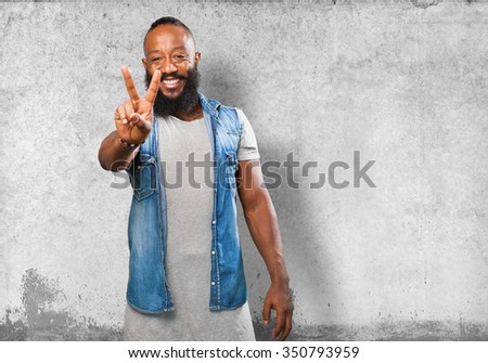 black man doing a victory sign