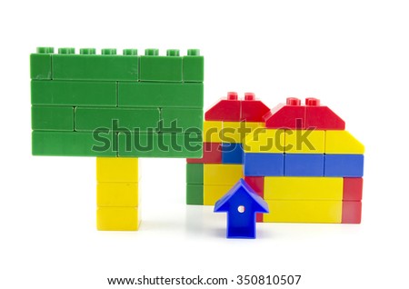two home icon made from plastic building blocks and signage  isolated on white background